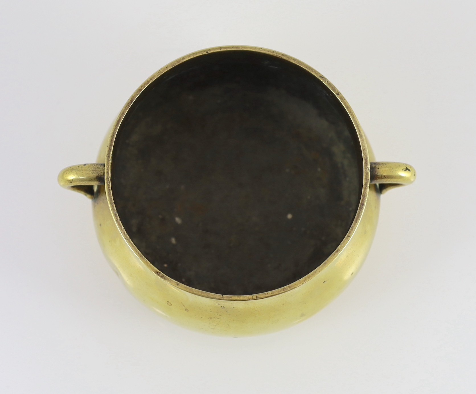 A Chinese polished bronze censer, gui, Xuande six character mark, 18th/19th century, 19cm wide, dented, solder repair